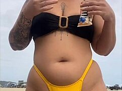 tight yellow bikini splits swollen pussy on crowded beach