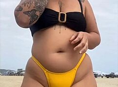 tight yellow bikini splits swollen pussy on crowded beach