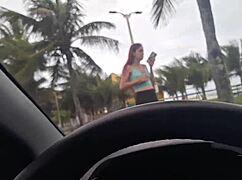 this pretty african girl risks public masturbation on beach sidewalk while cars pass by