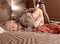 she grabs the homemade strapon and fucks him senseless while he's cuffed up