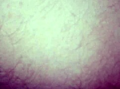 lady poses seductively in intimate close-up session