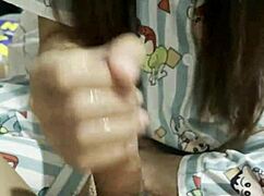 Asian Babe Jerks Boyfriend's Cock in Explosive Handjob