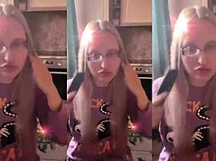 blonde with glasses brushes long hair using lollipop in asmr whispers
