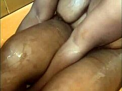 Chubby ebony milf's curvy belly and big shaved pussy tease in steamy bath