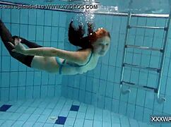 Petra's Shaved Teen Pussy Dives Underwater in Pool Tease