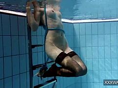 Petra's Shaved Teen Pussy Dives Underwater in Pool Tease