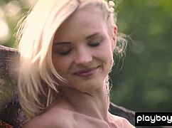 Hungarian blonde Mikki Galante bares shaved pussy outdoors on meadow