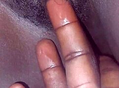 Watch her rub big black cock over hairy pussy then fuck