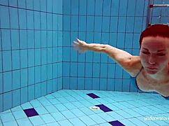 Martina teases in blue bikini her tight pussy flashes underwater at pool beach shower