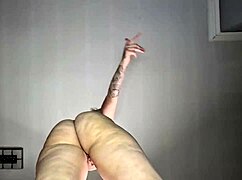 tattooed babe sways nude hips in dual camera tease