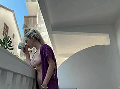 wanna see this blonde flash her shaved pussy and big tits naked on balcony?