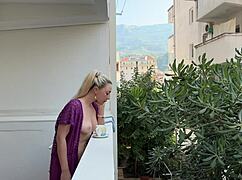 wanna see this blonde flash her shaved pussy and big tits naked on balcony?
