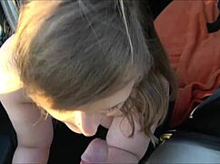 Stranded young babe bends over old car