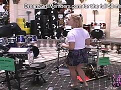 Hey, she's flashing those huge milf tits and pussy right in the guitar shop!