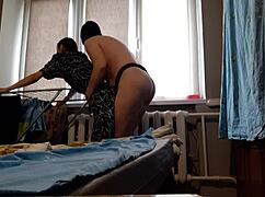 While my girlfriend hangs laundry I fuck her hard with strapon