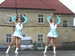 Two Busty Cheerleader Majorettes Show Off Assets