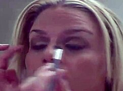 Blonde Prostitute Applies Makeup In Seductive Close-Up Tease