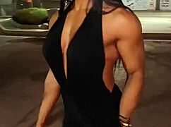 Erotic female bodybuilder babe flexes her muscular power in hot display