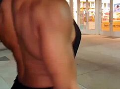 Erotic female bodybuilder babe flexes her muscular power in hot display