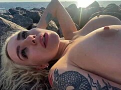 omg this hot blonde flashes her big tits and rubs clit on public beach 🏖️🔥