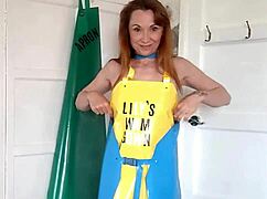 check out this squirting milf in pvc apron fingering her shaved pussy nonstop
