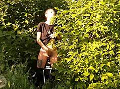 brunette risks public orgasm masturbating pussy in wild nature