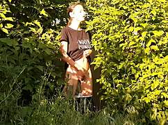 brunette risks public orgasm masturbating pussy in wild nature