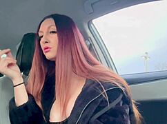 Hey, Italian milf Artemisia smokes cigs flashing big tits nipples in car.