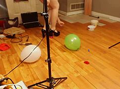 Fifi Foxx Teases in High Heels While Popping Balloons Seductively