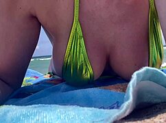 italian milf artemisia flashes juicy tits in micro bikini at beach