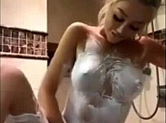 blonde babe strokes her perfect body and big tits