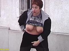 Redhead BBW milf pees outdoors showing huge tits melons
