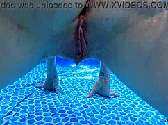 Arielle Lane swims naked by the pool showing off her pretty ass and pussy close up