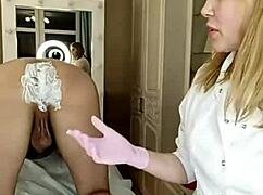 a beautiful woman shaves her big cock guy's pubis and anus smooth while he's bent over on all fours fetish style