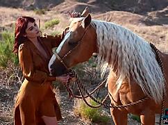 Natural redhead milf odette strips naked loving outdoor breeze on big tits