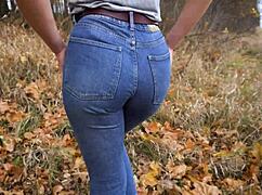 Milf teases huge ass in tight blue jeans outdoors