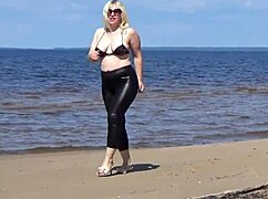 check this big leather ass milf strutting beach in heels.