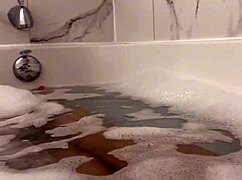 Petite teen moans loudly while showering tight wet pussy