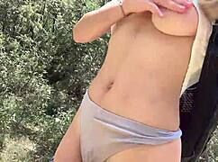 cute college blonde strips naked in jungle flashing big natural tits and ass