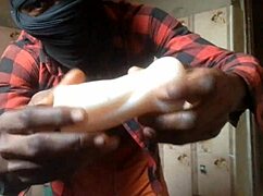 Dude rams silicone vagina toy hard while home alone