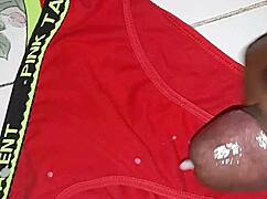 Ebony mature moans loud jerking thick cock close-up in homemade clip
