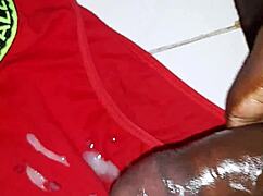 Ebony mature moans loud jerking thick cock close-up in homemade clip