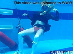 Horny Ashlee Rose slut in dress scuba dives underwater slowly