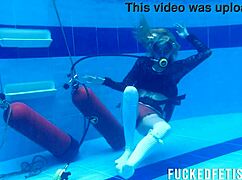 Horny Ashlee Rose slut in dress scuba dives underwater slowly