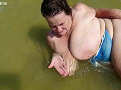 granny's beach boobs burst out for plump pussy fingering