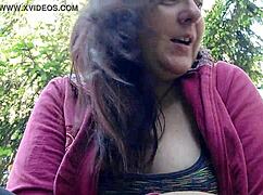 oh man nicoletta's lighting up in the garden then yanks out those huge tits for ya...