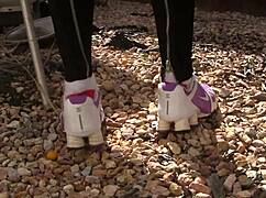 sneakers stride public paths in outdoor foot fetish tease
