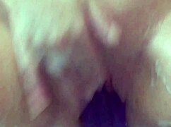Masturbating wildly in the bath, my big purple dildo drives me to explosive cum