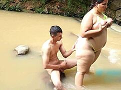 colombian mommy spoons with stepson by the river