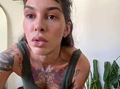 inked babe stretches with rubber bands in sfw yoga workout